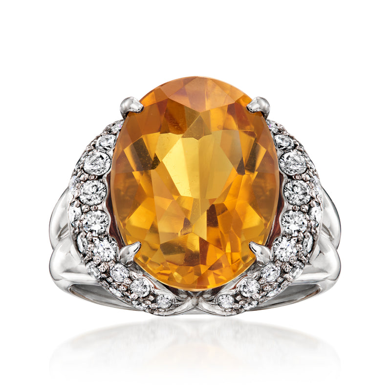 Platinum ring with large oval citrine center and diamond halo, size 5.75
