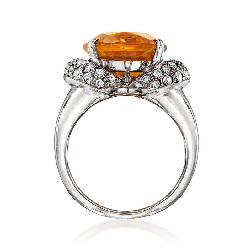 Platinum ring with oval citrine center and diamond cluster shoulders