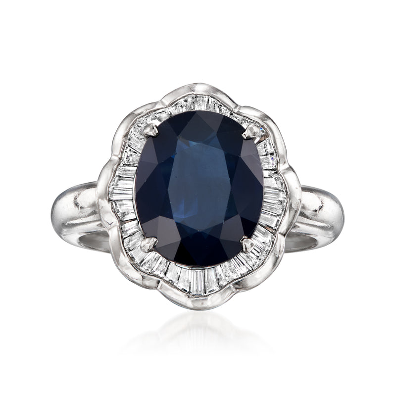 Platinum vintage ring with dark blue oval sapphire and diamond halo, split band