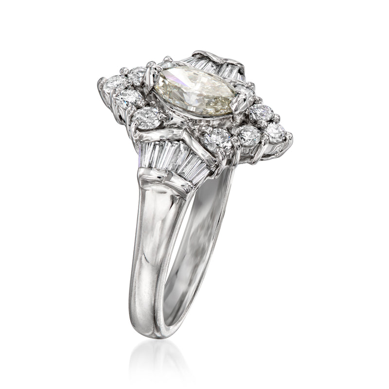 Vintage platinum diamond ring with marquise center stone and round side stones