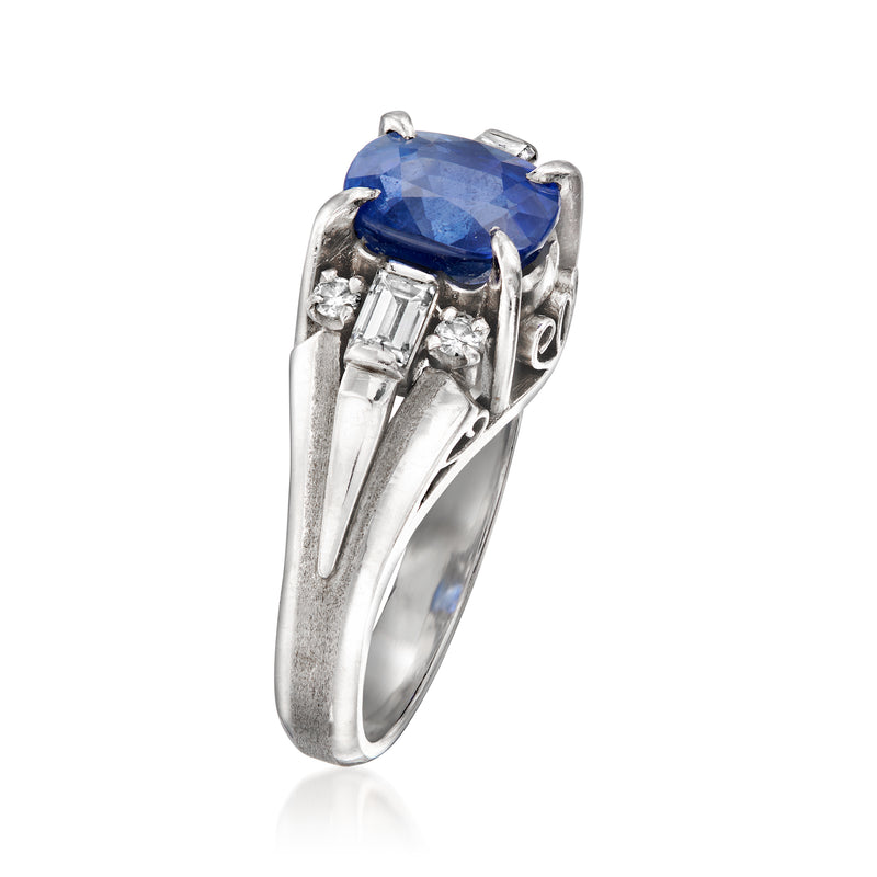 Blue sapphire and diamond accent ring with sculpted white metal band