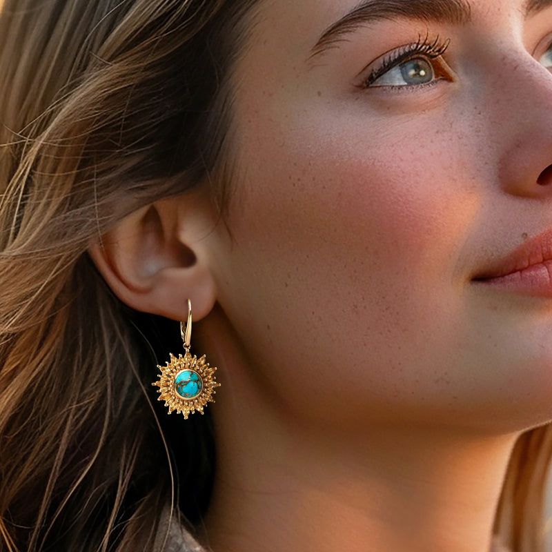 Gold sunflower drop earrings with turquoise center stone and leverback closure
