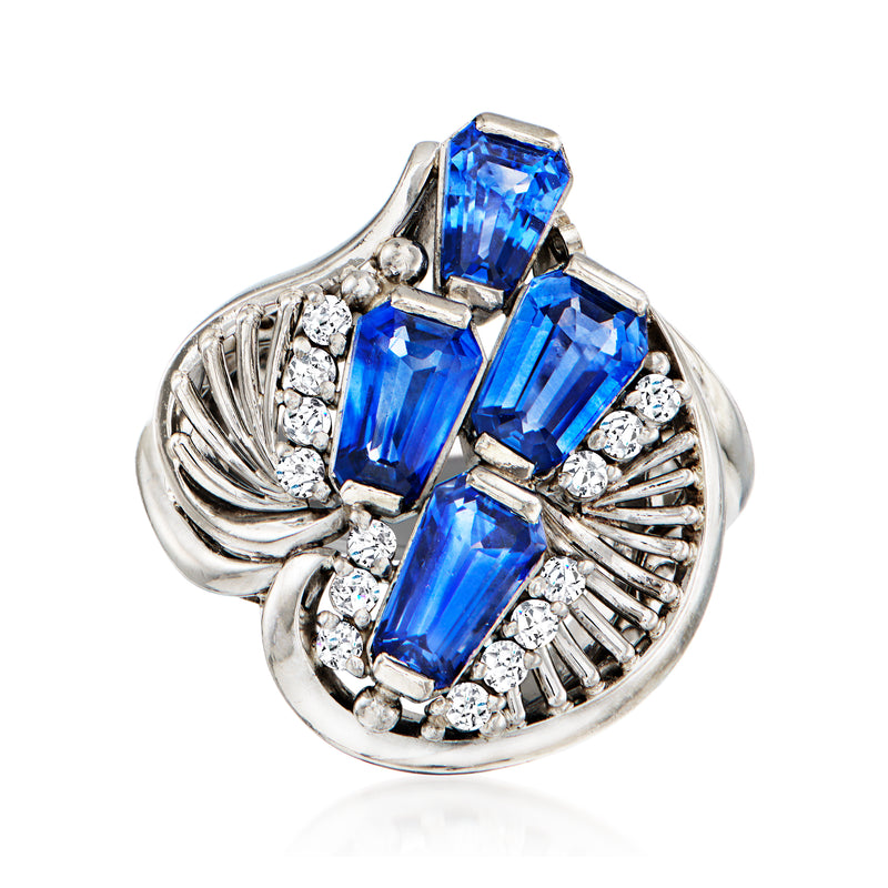 Vintage platinum ring with blue sapphire center and diamond accents, size 7