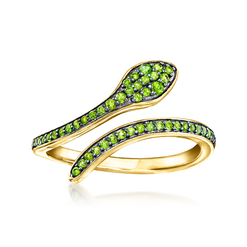 Snake bypass ring in 18kt gold over sterling silver with green gemstone settings