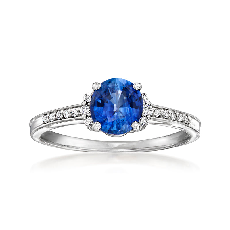 Platinum ring with oval blue sapphire center and small round diamond accents