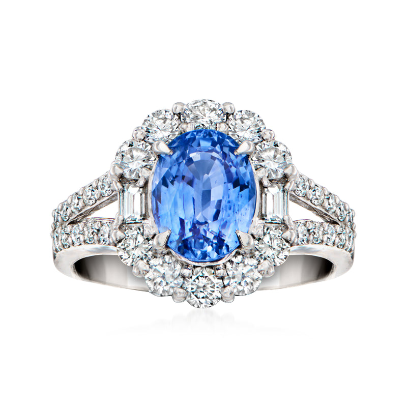 Platinum vintage-style ring with oval blue sapphire center and diamond halo