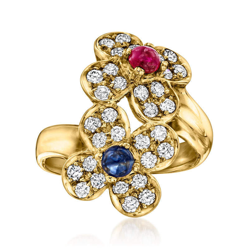 18kt yellow gold flower bypass ring with ruby and sapphire stones, surrounded by diamonds