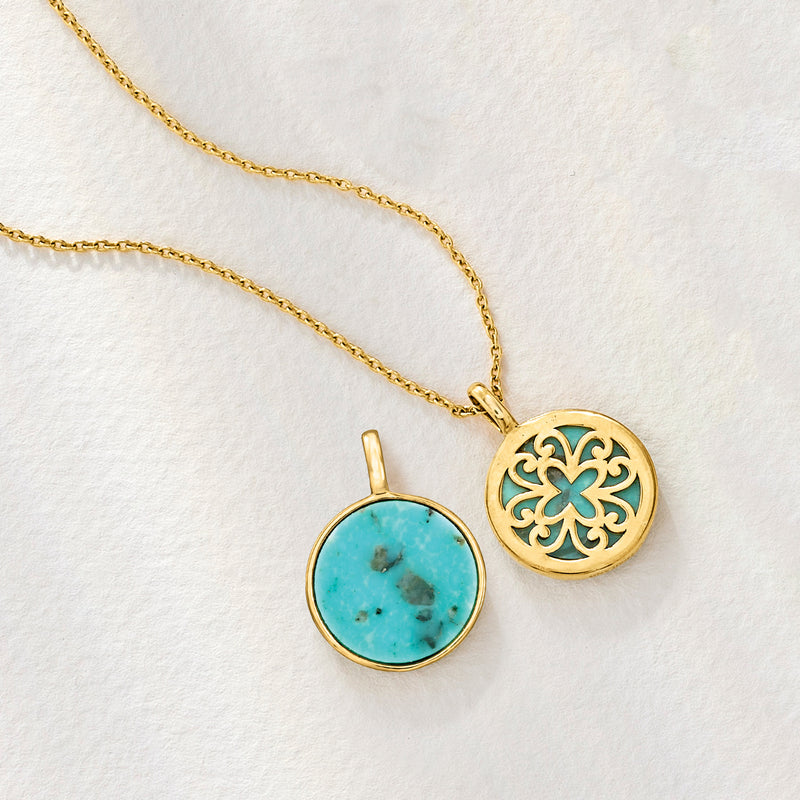 Gold chain necklace with two round turquoise pendants, one filigree and one plain