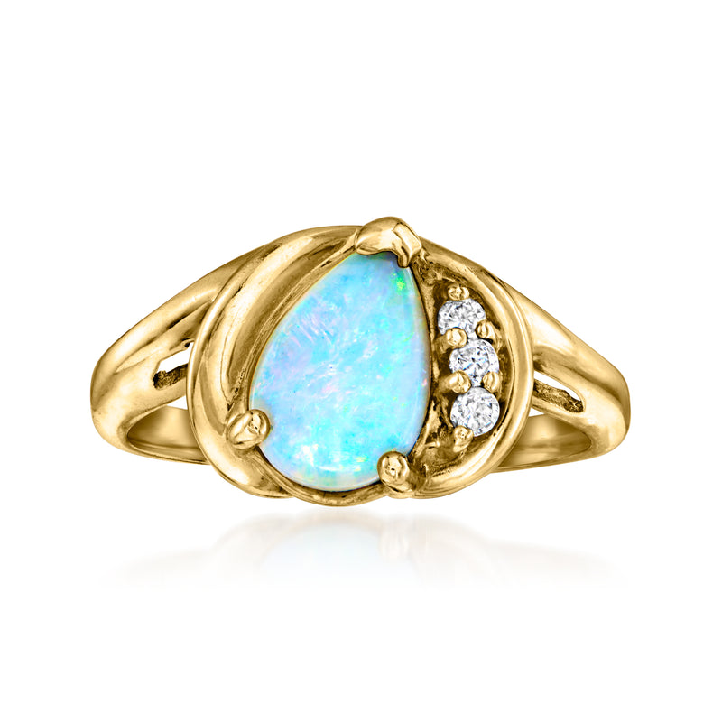 Vintage opal diamond ring with oval opal center, 14kt yellow gold band and bezel stones