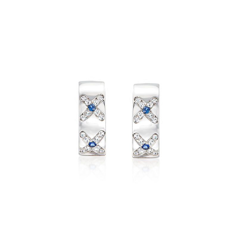 Curved 18kt white gold earrings with diamond accents and blue sapphire stones