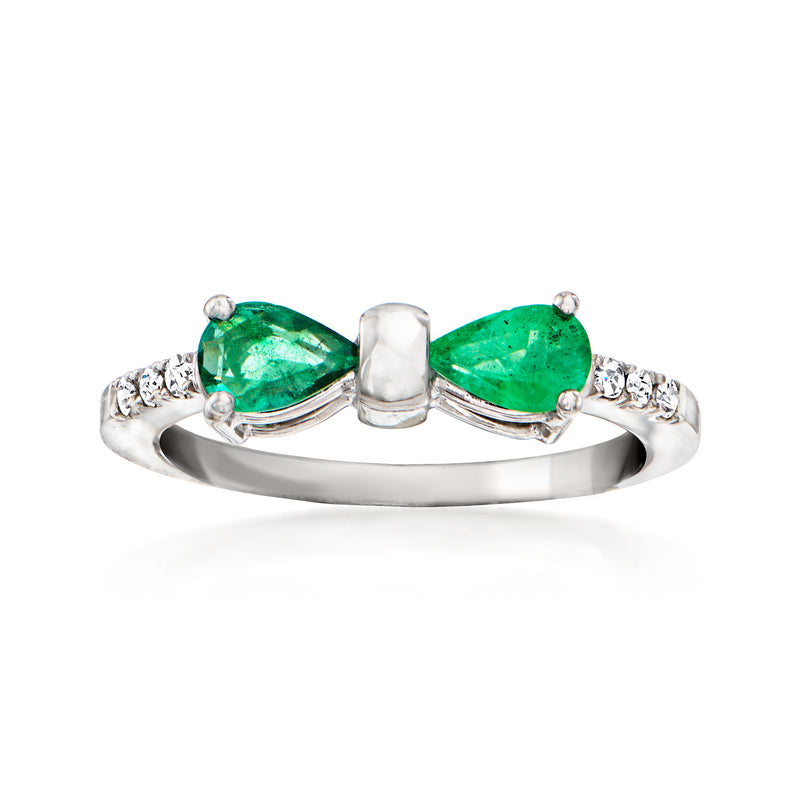 Emerald bow ring in white gold with two green pear-shaped stones and diamond accents