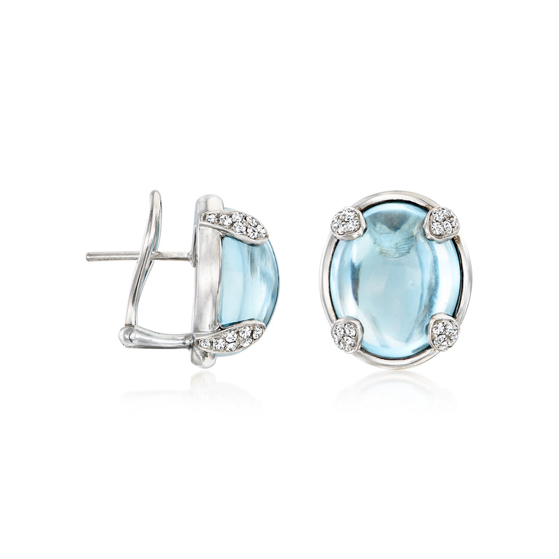Vintage sky-blue topaz stud earrings with diamond halos and post backs, white gold
