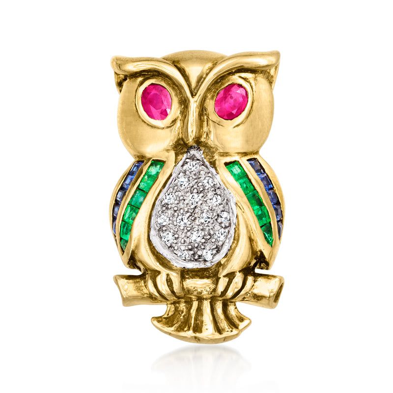 Gold owl gemstone pin with pink eyes, green and blue accents, and diamond-like center