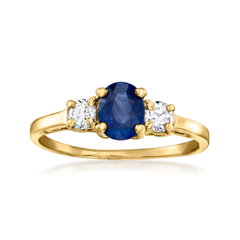 14kt yellow gold ring with oval blue sapphire and four round diamonds