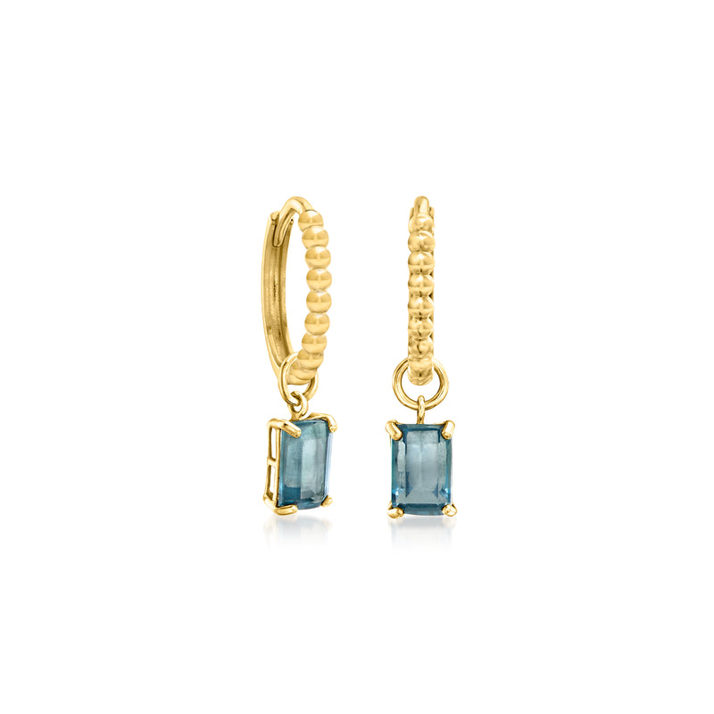 Yellow gold huggie hoops with textured bead ring and blue gemstone-like charms