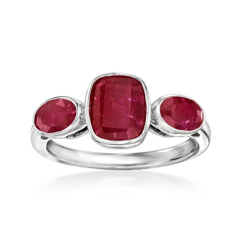 Sterling silver three-stone ring with cushion and two oval ruby red gemstones