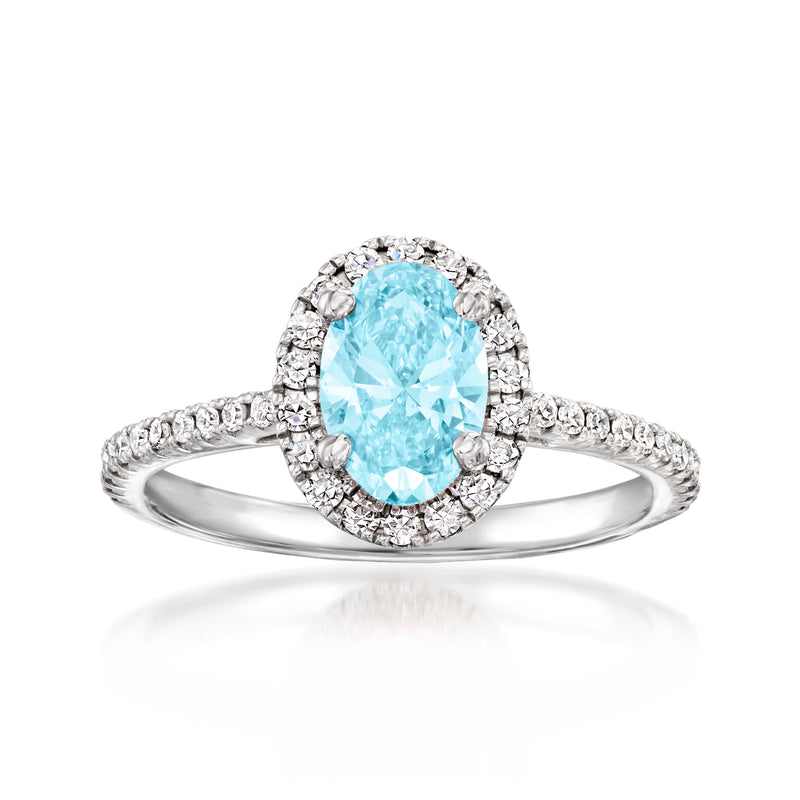 14kt white gold ring with oval light-blue center and halo of white diamonds