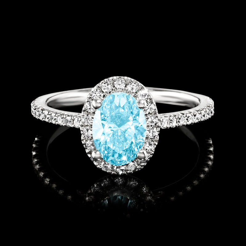 White gold ring with oval blue center diamond and pavé white diamond halo