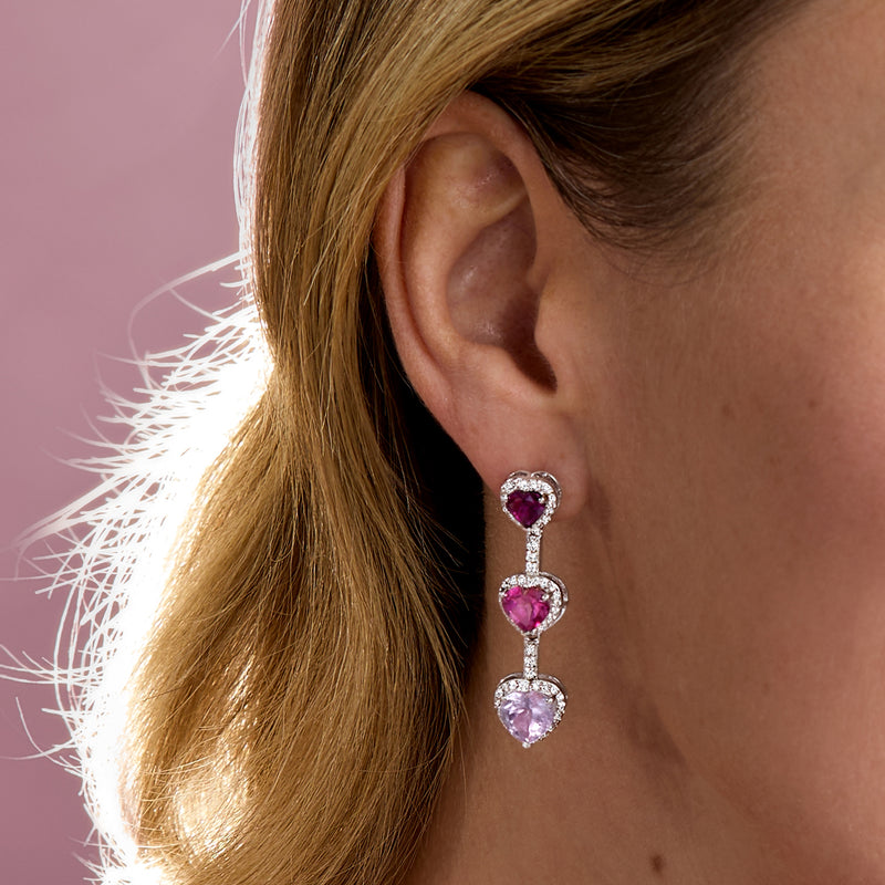 Heart drop earrings in sterling silver with three purple/pink heart stones