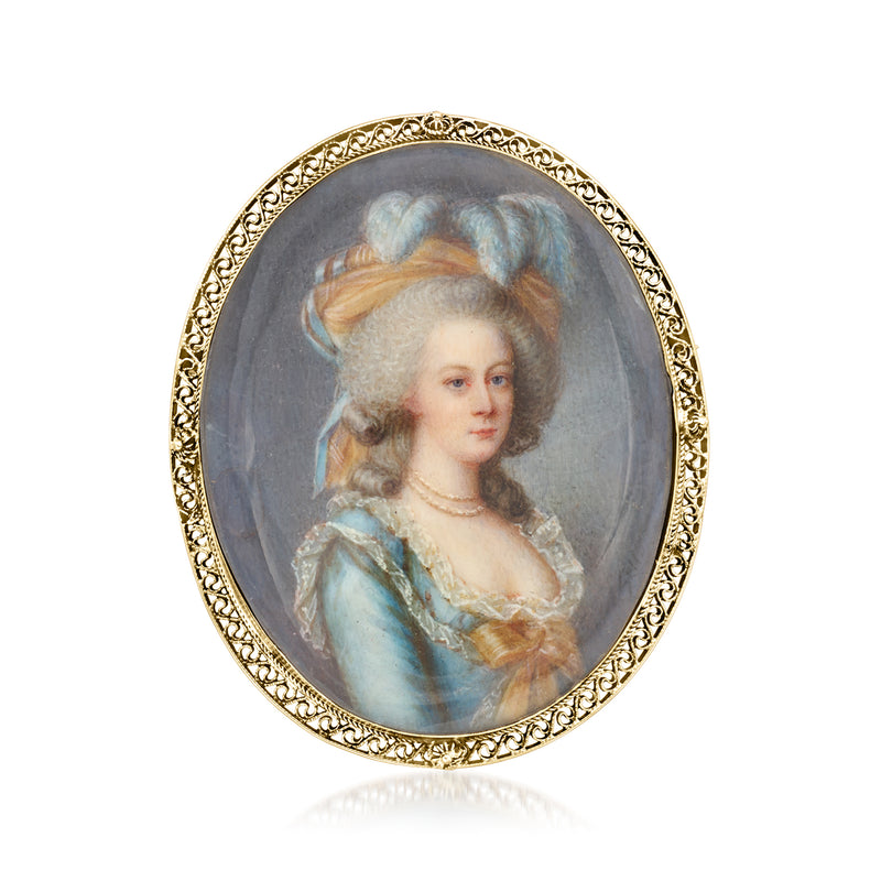 Oval portrait pendant pin with ornate 14kt yellow gold frame and painted woman portrait