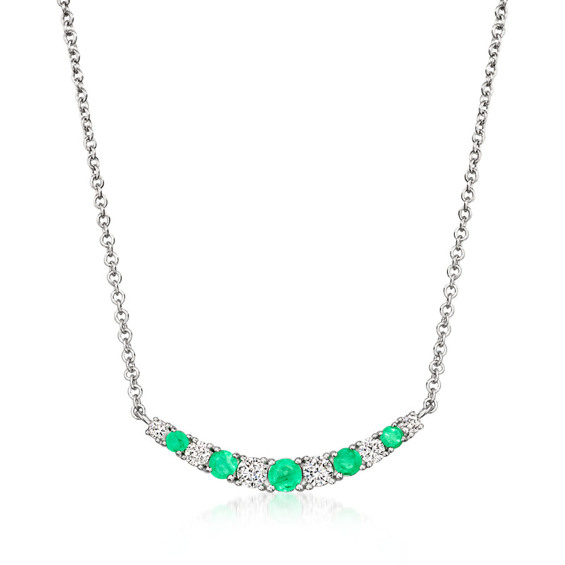 Sterling silver curved necklace with green oval gemstones and small clear diamonds