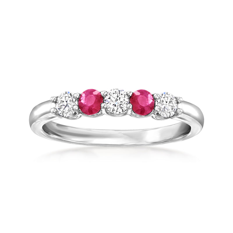 Sterling silver ring with three pink ruby stones and round diamond accents