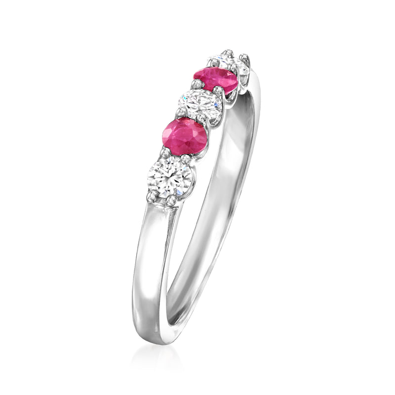 Sterling silver ring with pink round stones and round clear diamond accents, side view