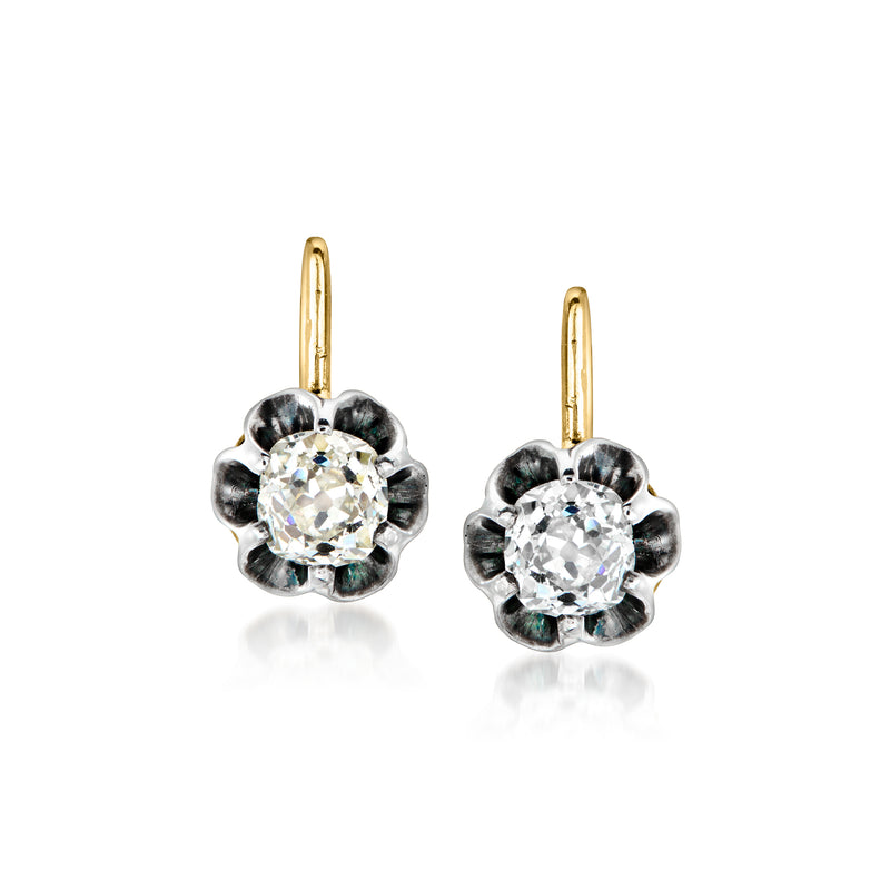 Vintage diamond drop earrings with round center stone, silver flower setting, gold hooks