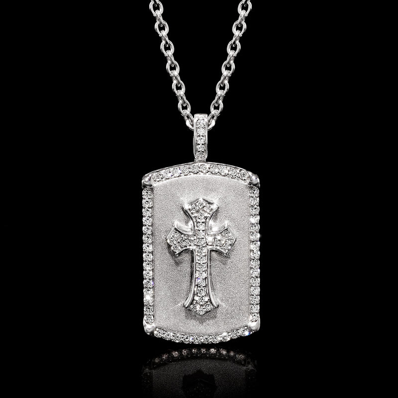 Sterling silver dog tag pendant with raised cross motif and diamond border