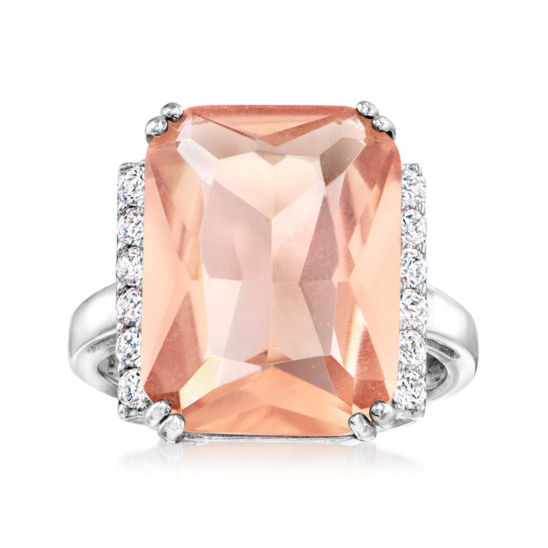 Sterling silver ring with large emerald-cut pink morganite-style center stone and CZ sides