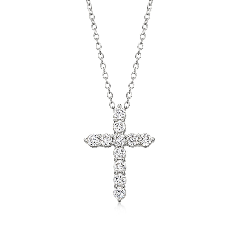 Sterling silver cross pendant with round diamond accents, on a linked chain necklace