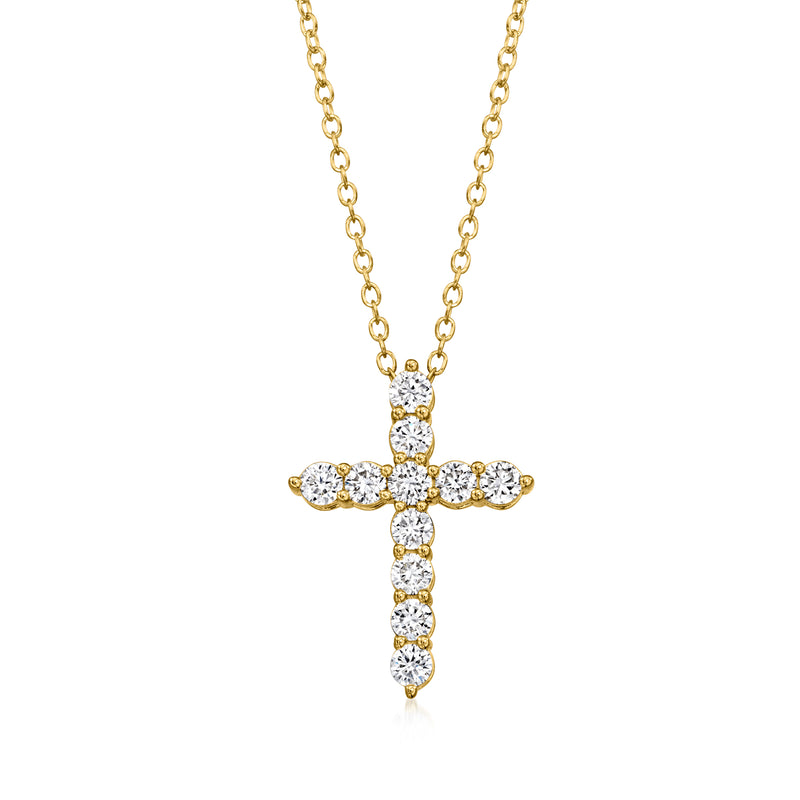 Gold cross pendant necklace with small round diamond accents on a linked chain