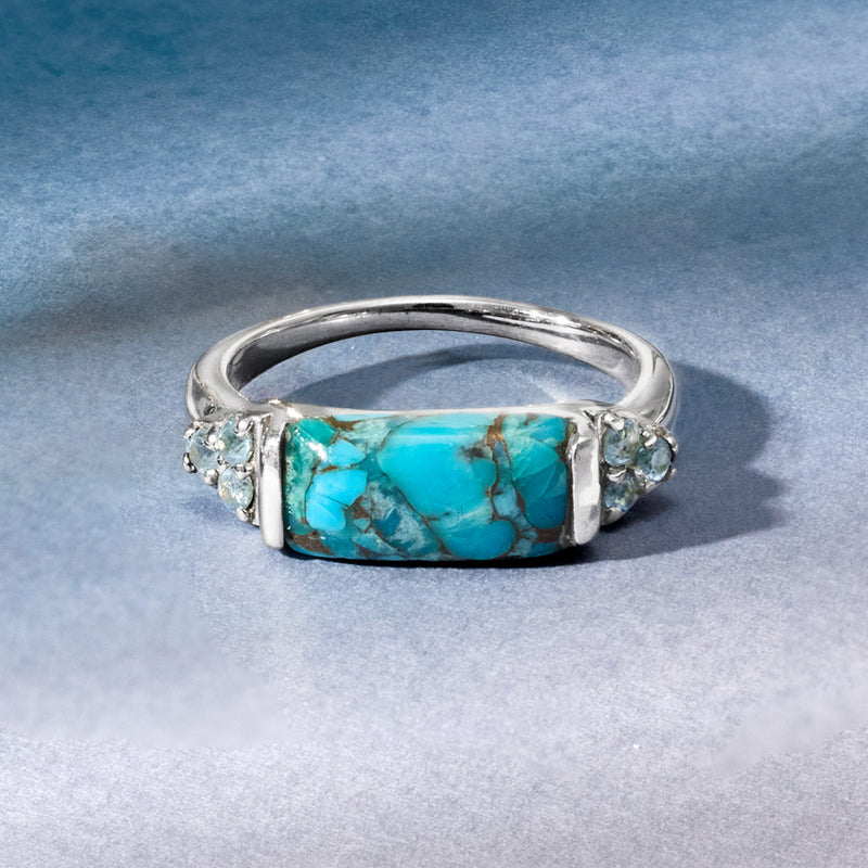 Turquoise rectangular gemstone ring with blue round stones on sterling silver