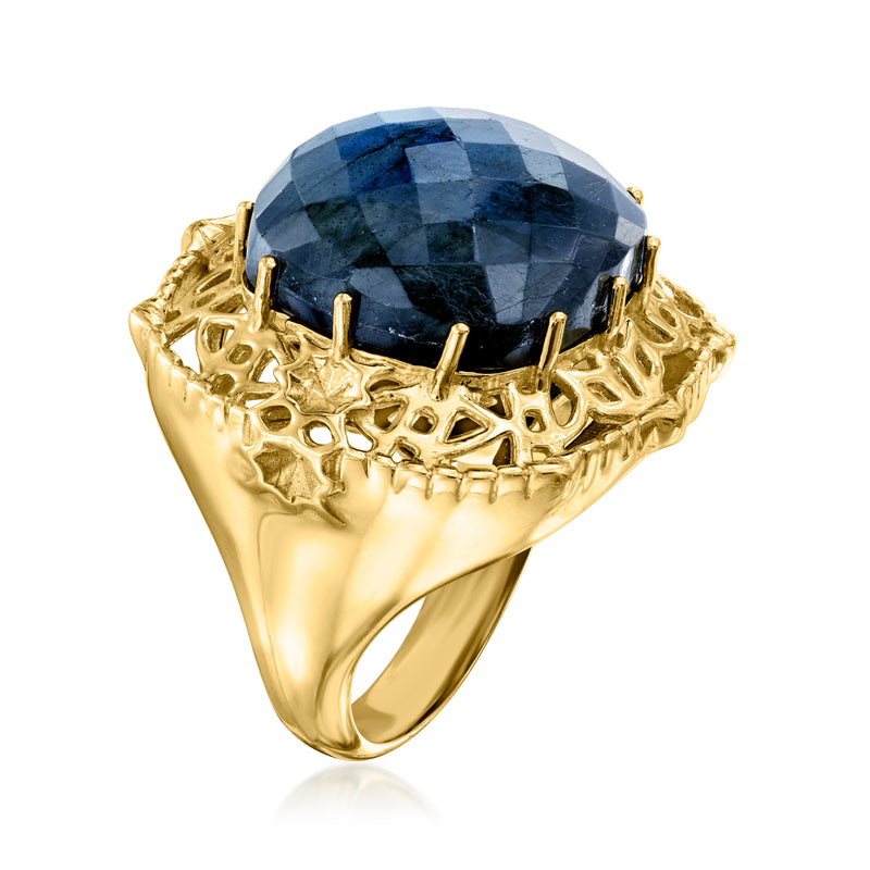 Gold-tone labradorite ring with oval dark blue faceted stone and openwork gallery setting
