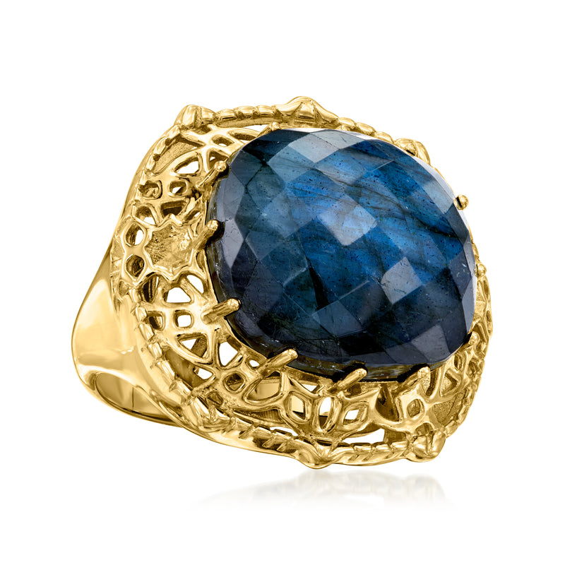 Gold labradorite oval gemstone ring with faceted navy-blue stone and decorative lattice mount