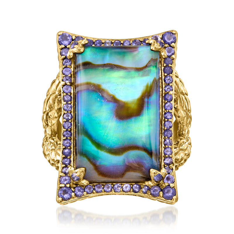 Gold-tone ring with square abalone shell center, purple gemstone border, ornate band