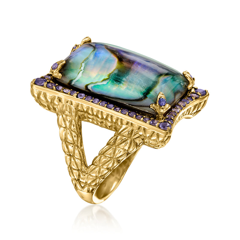 Gold-tone abalone shell ring with rectangular bezel, purple stone accents, textured cuff band