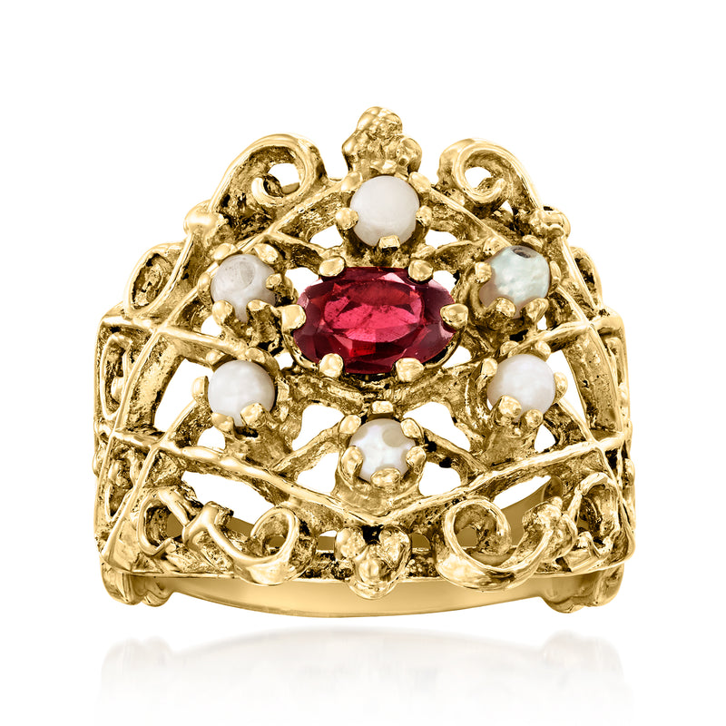 Vintage 14kt yellow gold ring with oval garnet center and white seed pearls