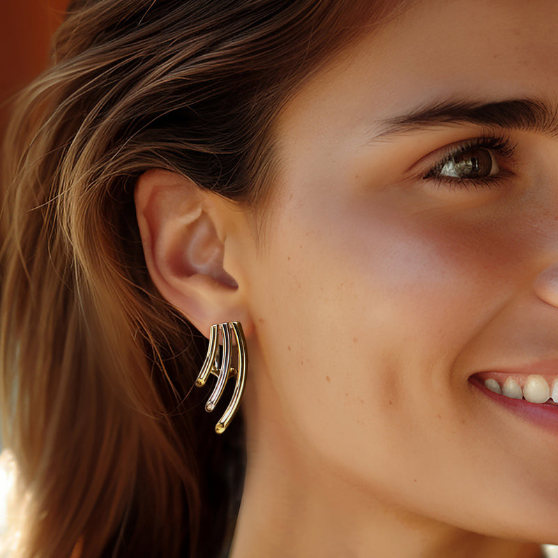 14kt two-tone gold curvy trio drop earrings worn on ear, three crescent drops