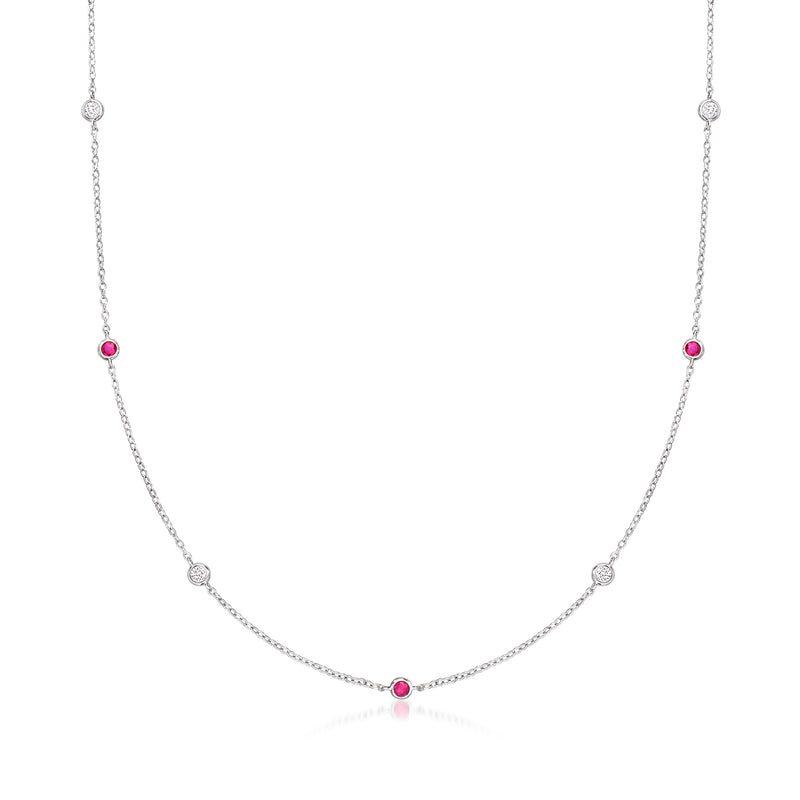Sterling silver diamond station necklace with three ruby-red gemstone accents