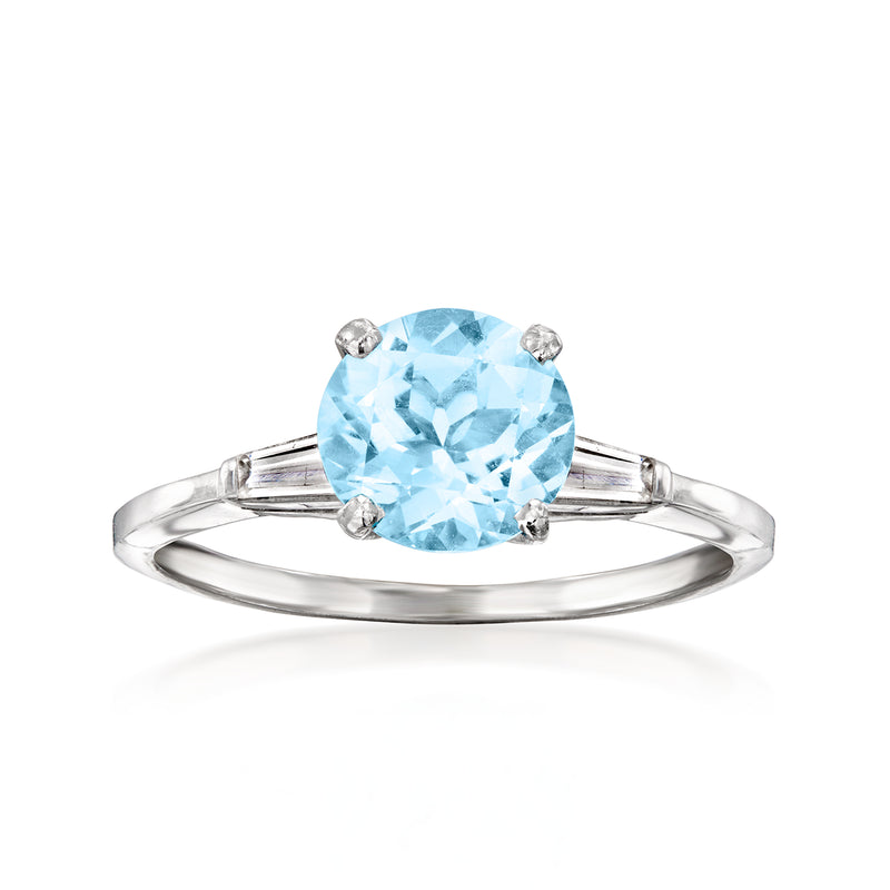 Platinum ring with oval sky blue topaz center and small diamond accents