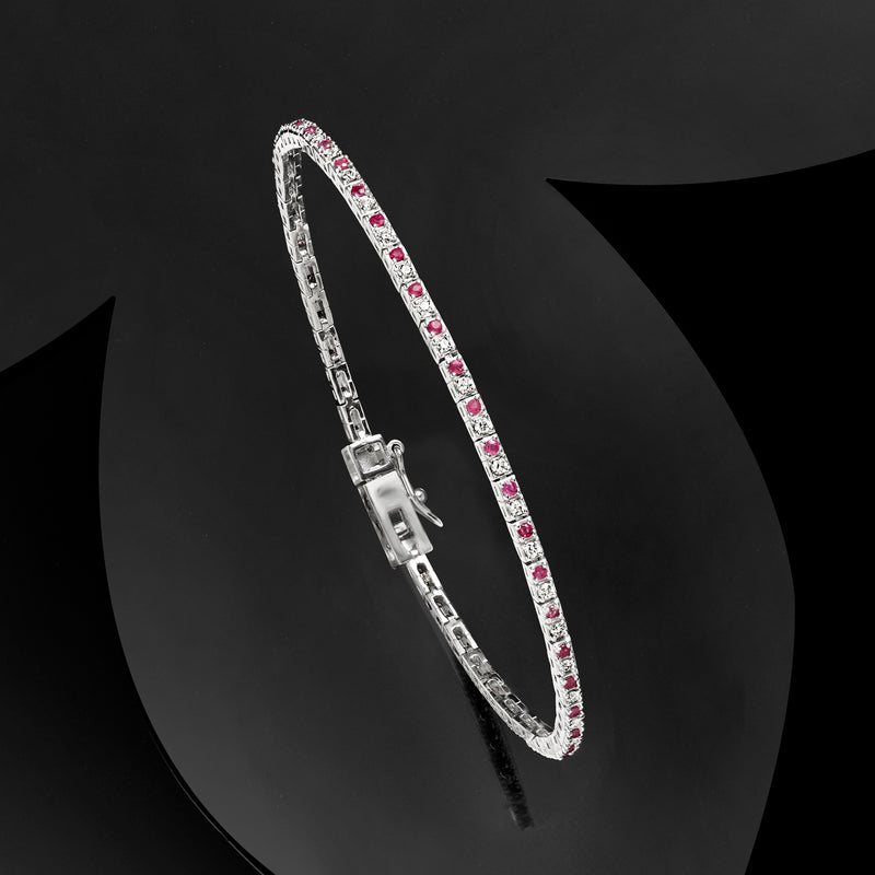 Sterling silver tennis bracelet with pink stones in rows and diamond accents