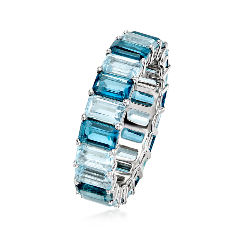 Angle view of sterling silver eternity band with blue topaz baguette gemstones