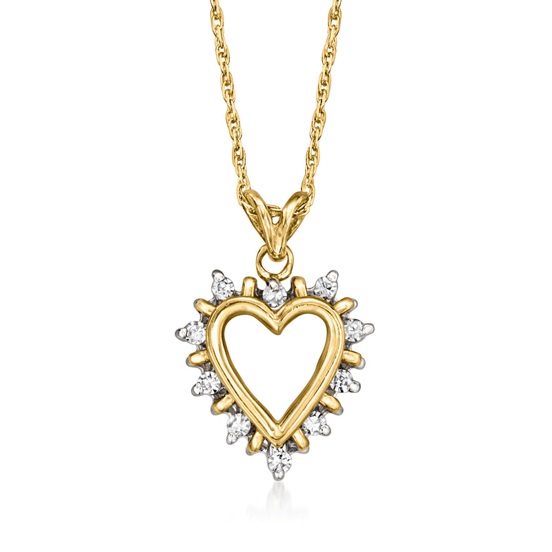 Two-tone gold heart pendant necklace with diamond clusters on a gold chain