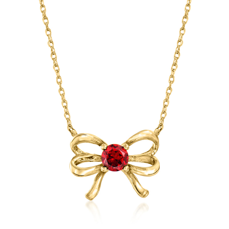 10kt yellow gold bow necklace with round red garnet center