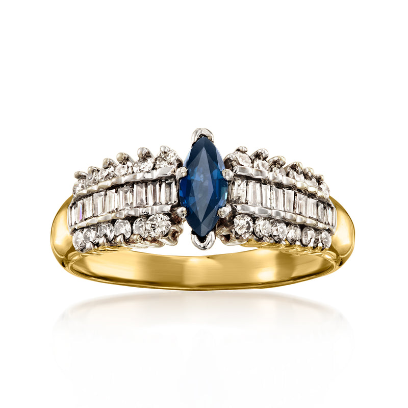 Vintage sapphire and diamond ring in 14k yellow gold, oval blue center with baguette accents