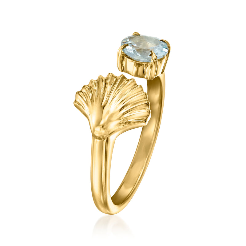 Gold seashell open-space ring with large oval aquamarine gemstone and textured shell top