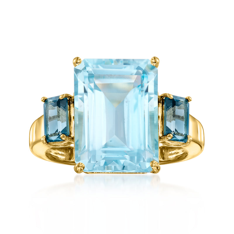 Gold-tone ring: large light-blue square gemstone with two dark-blue side stones