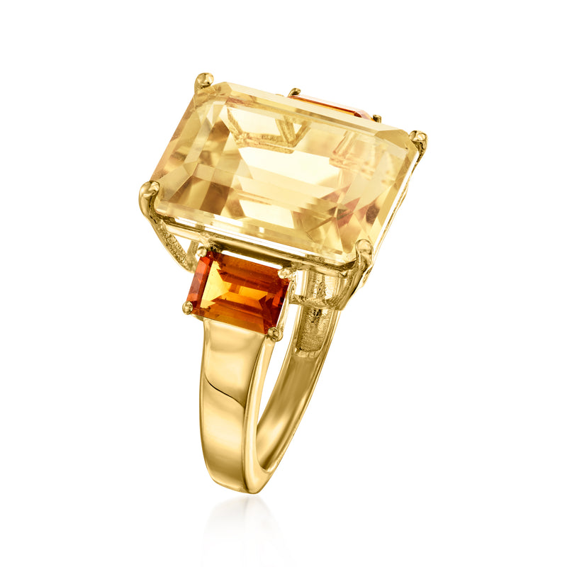 Gold ring with angled view of large square yellow stone and orange side gems