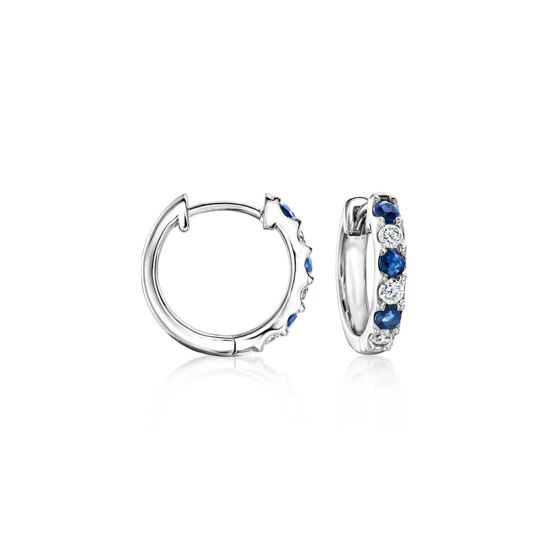 Sterling silver hoop earrings with blue sapphire stones and small clear diamond accents